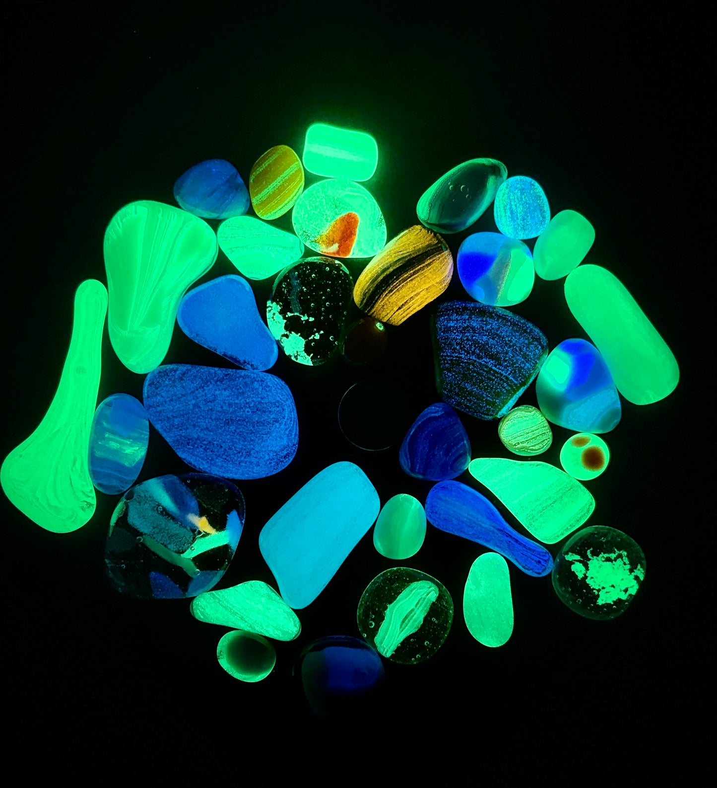 Glow grab bags full of glass blobs in various shapes, sizes and glow colours.