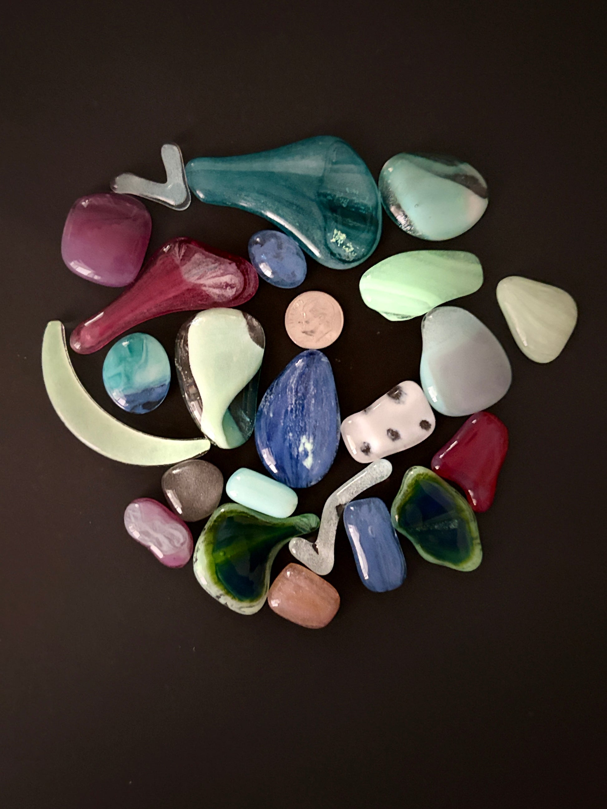 Glow grab bags full of glass blobs in various shapes, sizes and glow colours.