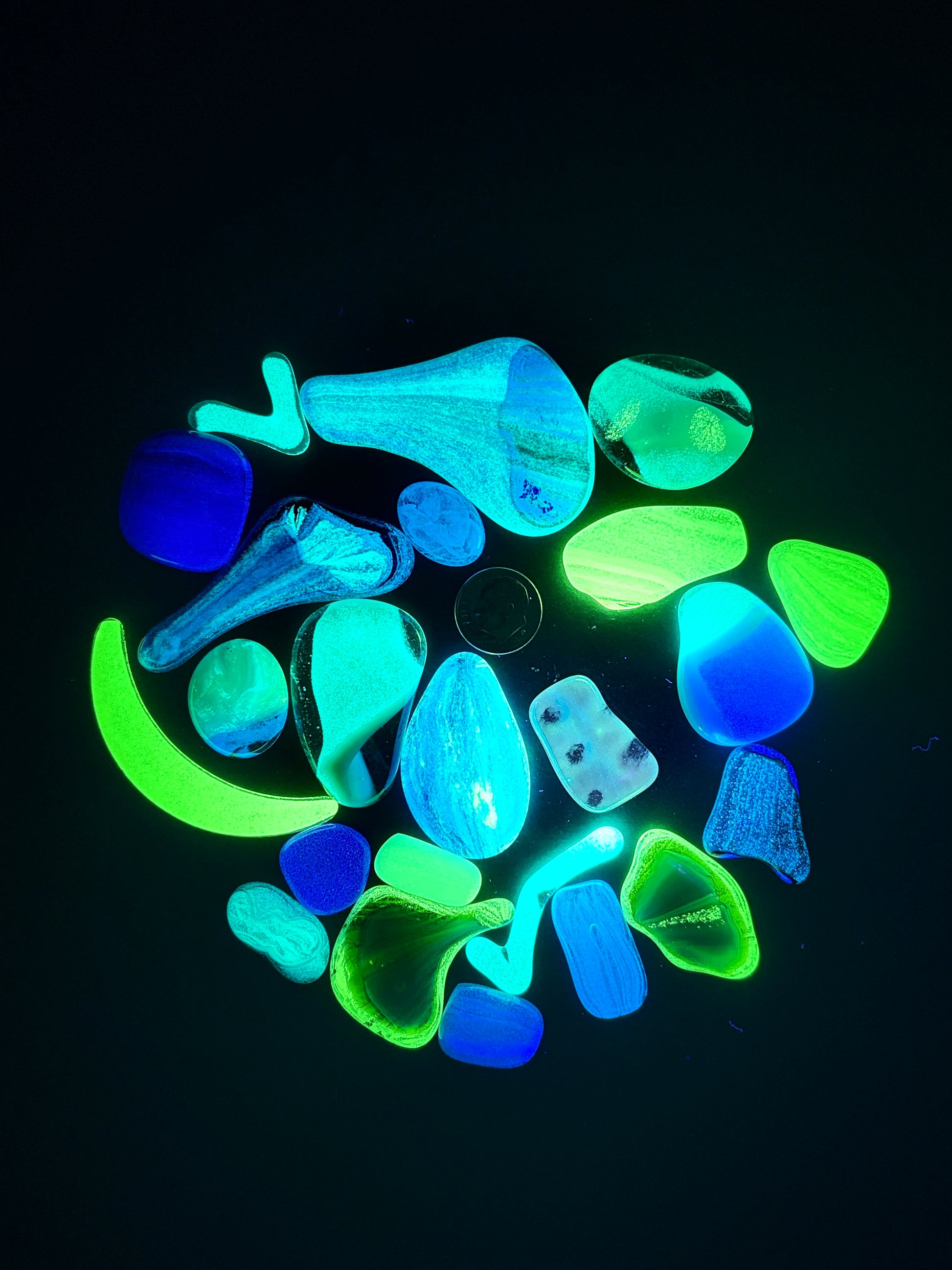 Glow grab bags full of glass blobs in various shapes, sizes and glow colours.